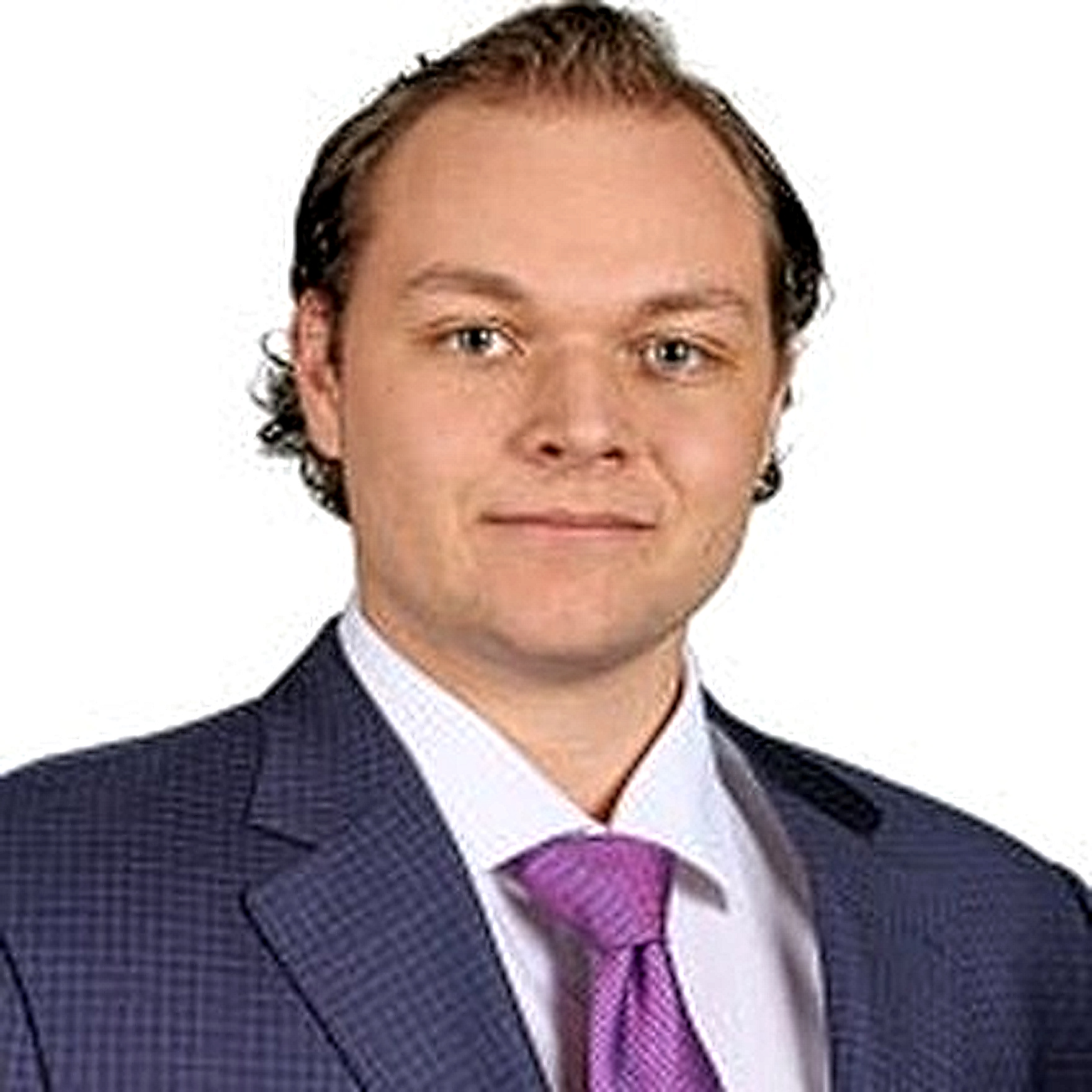 Ryan in a suit and tie